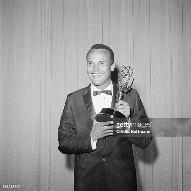 Harry Belafonte with his Emmy Award for his TV specials.