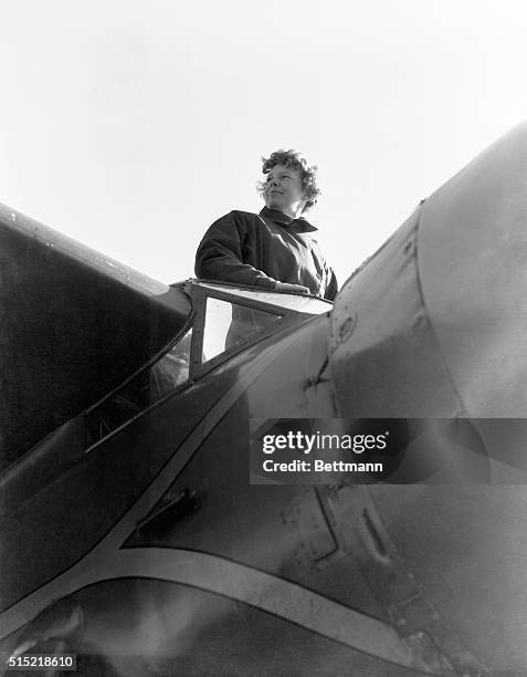 Amelia Earhart , American aviatrix, first woman to cross Atlantic Ocean in airplane. Photograph showing her, from below, in airplane. Undated...