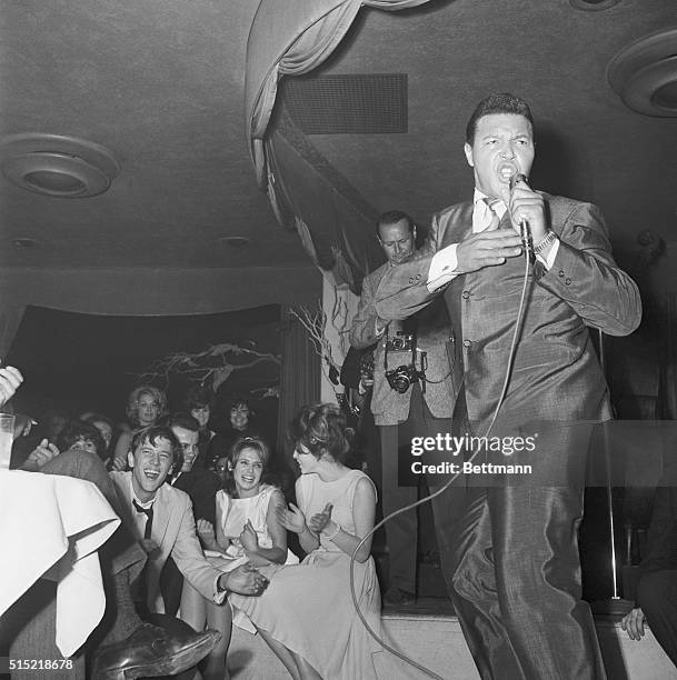 Hollywood, CA- Chubby Checker "twists" away as he introduces the new dance craze to Hollywood celebrities at The Crescendo, a night club on the...