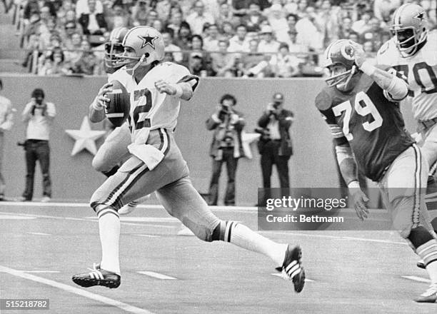 Irving, TX- Dallas Cowboys quarterback Roger Staubach scrambles to a Cowboy first down in the first period against the rival Washington Redskins at...