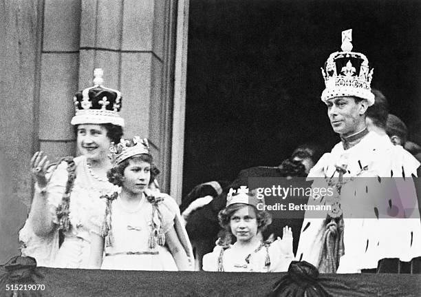 The crowned King George VI and Queen Elizabeth with Princess Elizabeth and Princess Margaret Rose, acknowledging the cheers of the crowd from the...