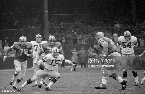 Detroit, MI- A quarterback who sees he's in trouble is Green Bay Packers' Bart Starr as Detroit Lions' defensemen Darris McCord , Alex Karras and...