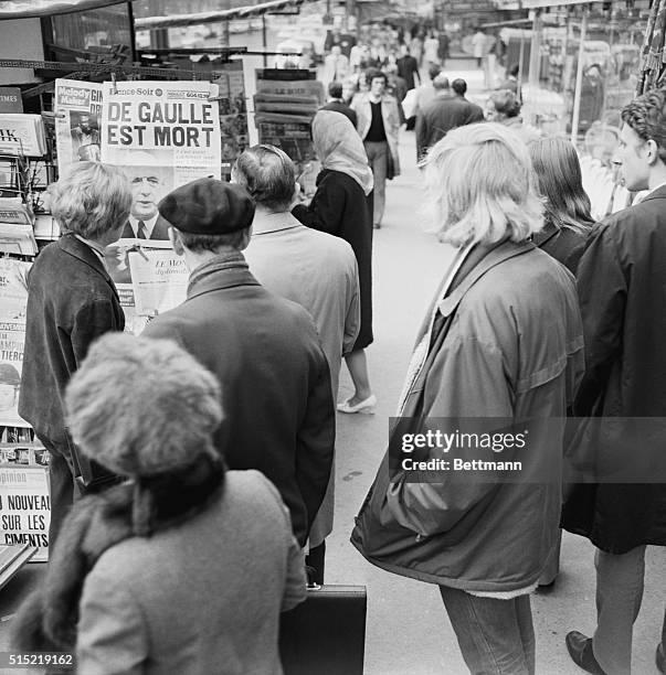 Paris, France- Parisians mob newspaper kiosks here early Nov.10th to read headlines announcing the death of former French President Charles De...