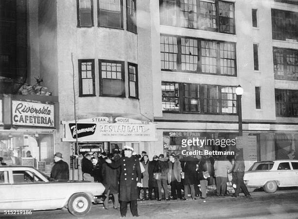 Boston, Massachusetts- Newsmen and photographers gather in front of the entrance to the apartment where Mary A. Sullivan of Hyannis, MA, was found...