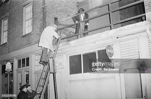 Boston, MA-Police check adjoining roof to apartment, rear of the building, where Mary A. Sullivan of Hyannis, MA, was found strangled to death, 1/4....
