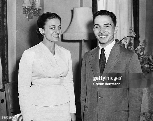 London, England- King Hussein of Jordan and his bride, Queen Dina, pose smilingly in their London hotel suite just after their arrival in London....