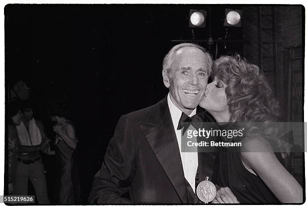 New York, NY-Henry Fonda gets a kiss from his daughter Jane, after she presented him with a surprise Tony Award for his "special, unending...