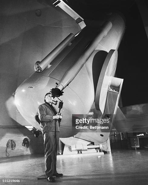Dr. Edwin P. Hubble, one of America's foremost astronomers, runs the 48-inch Schmidt Photographic Telescope through its final series of rehearsals...