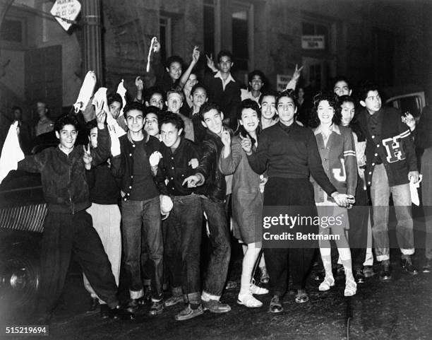 Group of Hispanic teenagers carry white flags and "surrender" at the Los Angeles central jail during the climax of the Zuit Suit Riots. In June of...