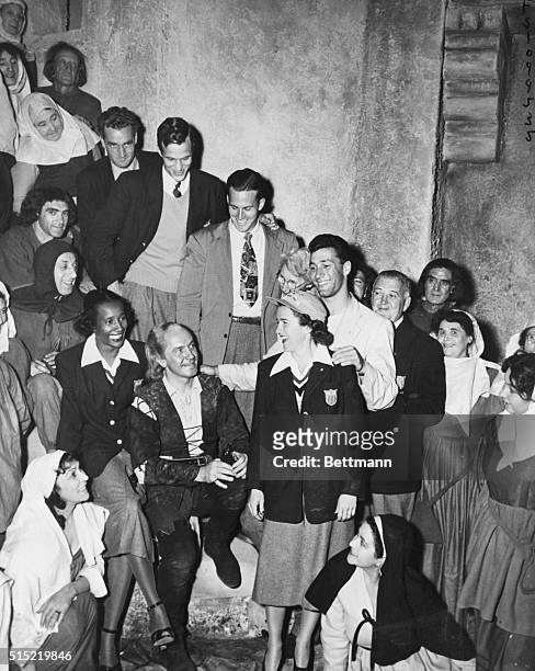 London, England-U.S. Olympic athletes had a merry day at a London film studio visiting American screen star Frederic March. Shown are Anthony...