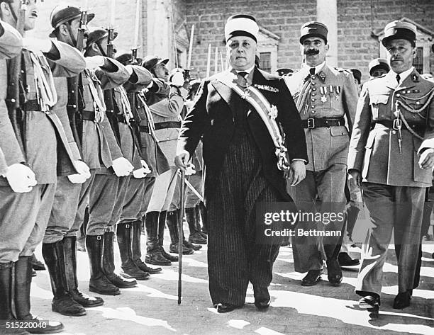 Damascus, Syria- Cheikh Taggadine,the new President of Syria,inspects a guard of honor of Free French troops outside the Town Hall.Syria was granted...