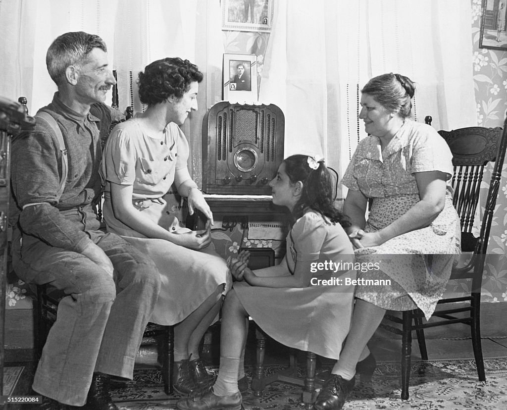 Family Gathered Around Radio