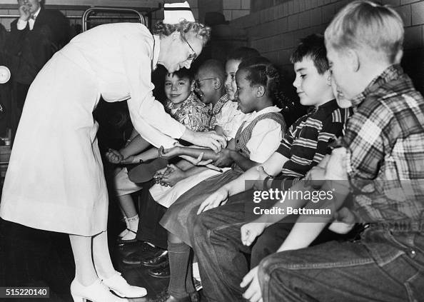 Nurse Preparing Children for Polio Vaccine Shots Nurse Preparing Children for Polio Vaccine Shots