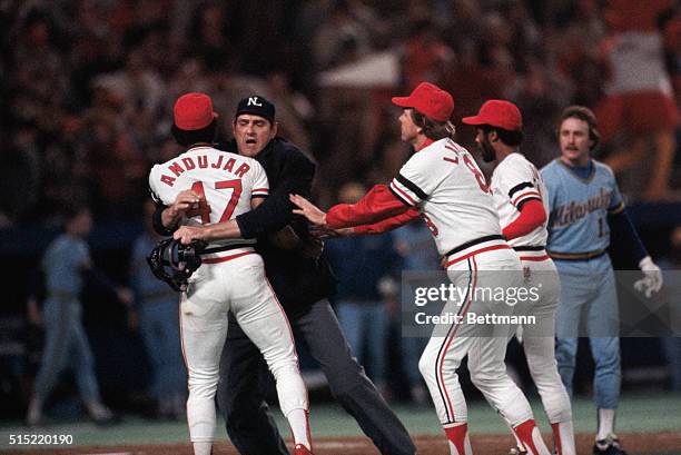 St. Louis, Missouri: St. Louis Cardinals pitcher Joaquin Andujar is restrained by the umpire during an argument with the Milwaukee Brewers Jim...