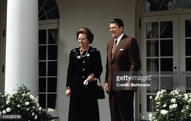 Washington, DC: President Ronald Reagan stands with Prime Minister Margaret Thatcher of England at the White House as Thatcher prepares to depart.