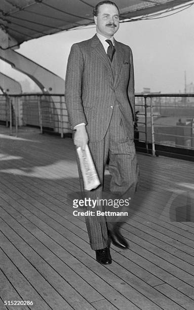 Captain Ernest Simpson, the former husband of the Duchess of Windsor, aboard the SS Queen Mary. If the gossips are correct, this is a prenuptial trip...