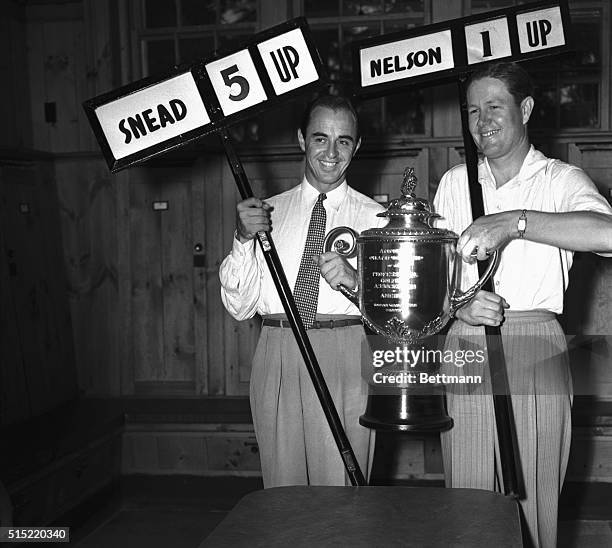 Sam Snead , of Shawnee-on-Delaware, Pennsylvania, and Byron Nelson, of Toledo, with huge cup they will battle for in the final of the PGA golf...