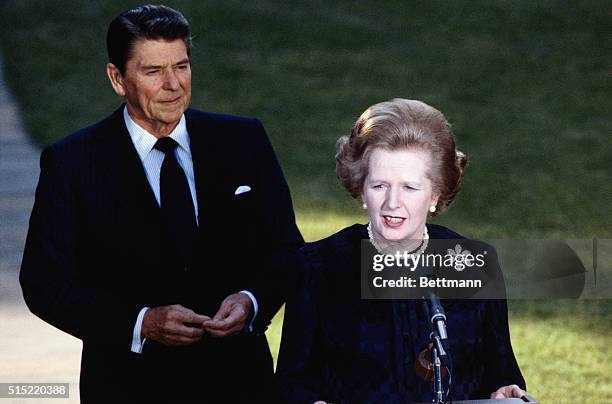 Washington, DC: President Ronald Reagan with Margaret Thatcher depart from the Oval Office.