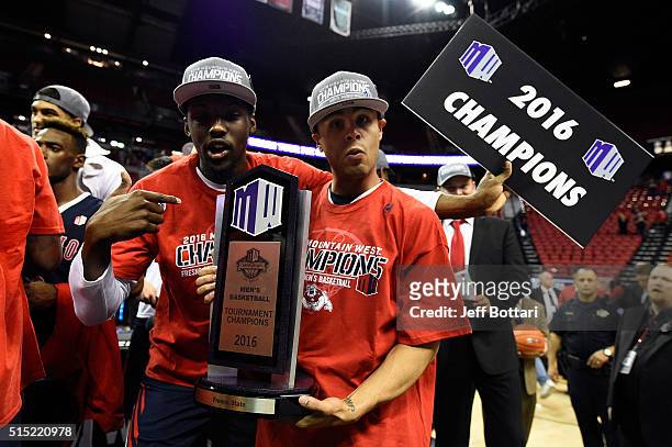Cezar Guerrero and Julien Lewis of the Fresno State Bulldogs celebrate after defeating the San Diego State Aztecs 68-63 to win the championship game...