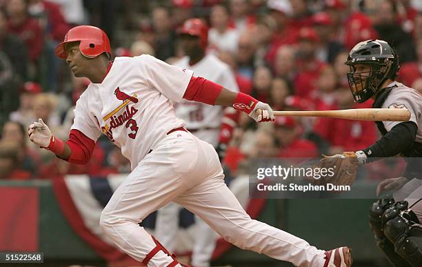 Edgar Renteria of the St. Louis Cardinals hits a 2 run RBI single against the Houston Astros in the third inning of game six of National League...