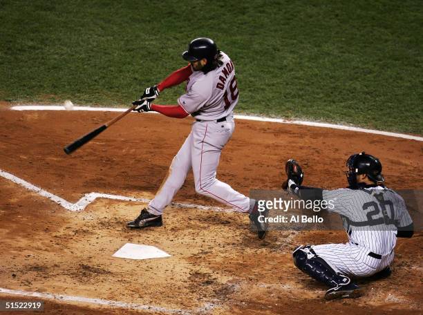 Johnny Damon of the Boston Red Sox hits a grand-slam home run in the second inning against the New York Yankees during game seven of the American...
