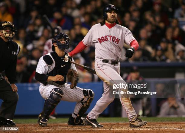 Johnny Damon of the Boston Red Sox hits a grand-slam home run in the second inning against the New York Yankees during game seven of the American...