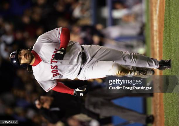 Johnny Damon of the Boston Red Sox runs to first base after hitting a grand-slam home run in the second inning against the New York Yankees during...