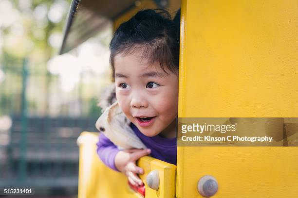 young girl looking out and smiling - skimpy girls stock pictures, royalty-free photos & images