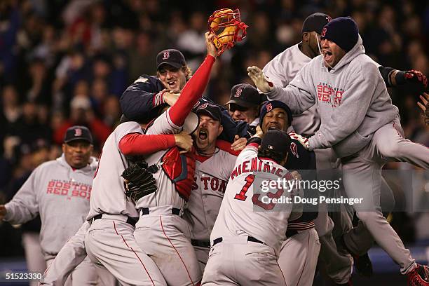 The Boston Red Sox celebrate after defeating the New York Yankees 10-3 in game seven of the American League Championship Series on October 20, 2004...