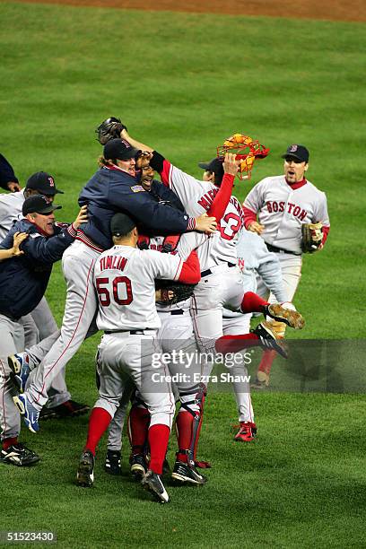 The Boston Red Sox celebrate after winning game seven of the American League Championship Series against the New York Yankees on October 20, 2004 at...