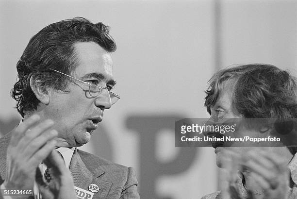 English politicians and Members of Parliament, William Rodgers and Shirley Williams applaud at a Social Democratic Party press conference in London...