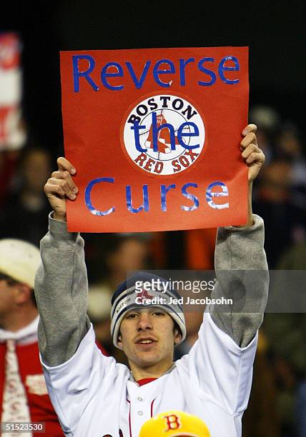 Boston Red Sox fan holds up a sign after defeating the New York Yankees 10-3 to win game seven of the American League Championship Series on October...
