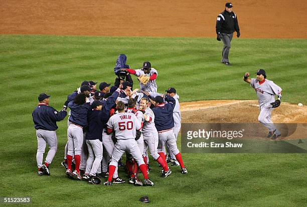 The Boston Red Sox celebrate after defeating the New York Yankees 10-3 to win game seven of the American League Championship Series on October 20,...