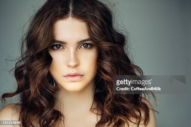 studio shot of young beautiful woman - brown hair stock pictures, royalty-free photos & images