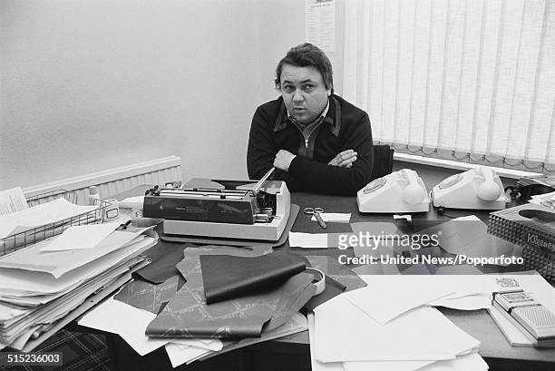 British magazine publisher and sex shop owner David Sullivan posed at an office desk in London on 8th February 1982.