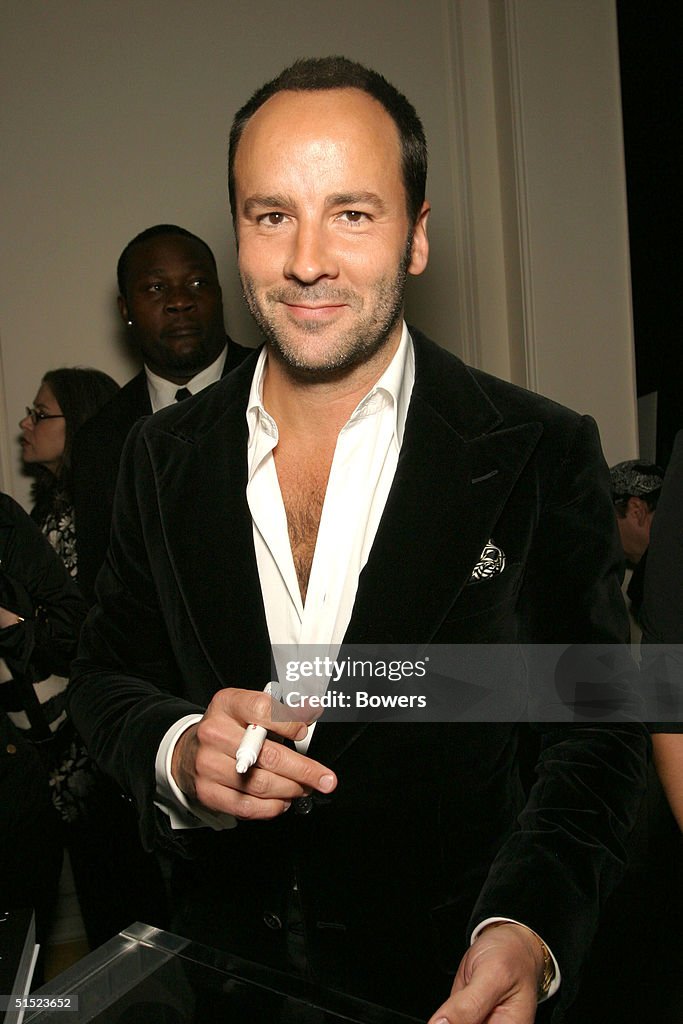 Fashion designer Tom Ford signs a copy of his book 'Tom Ford:Ten ...