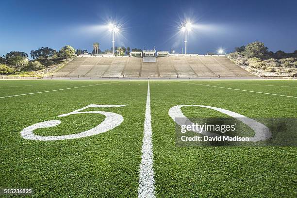 fifty-yard line, football field - football 50 yard line stock pictures, royalty-free photos & images
