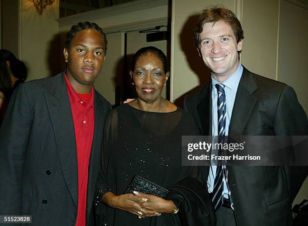 Oliver Saunders, Marie Claire Beauvais and Mike Nilon, husbad to honoree Garcelle Beauvais-Nilon are seen at the Optimist Youth Homes & Family...