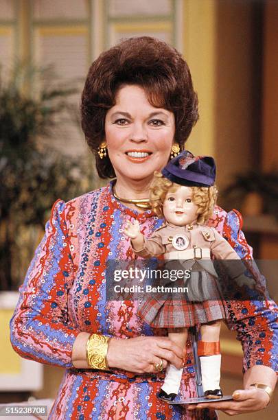 New York, New York: Actress Shirley Temple Black holds an antique "Shirley Temple" doll during an interview of the Good Morning America television...