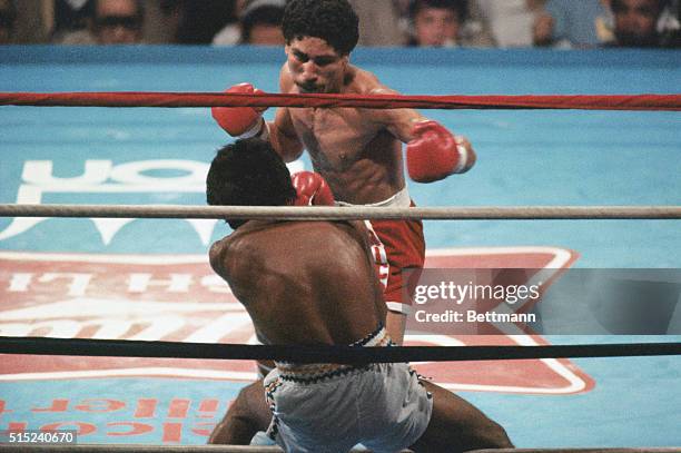 New Orleans, Louisiana: Wilfredo Gomez slams Lupe Pintor into the ropes of the rink during their bout for the Super Bantamweight Championship of the...
