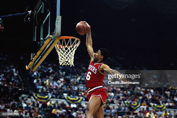 Action, Philadelphia 76ers' Julius Erving making a basket during unidentified game .