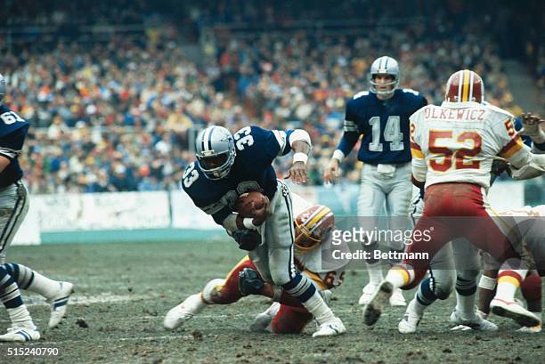 The Dallas Cowboys' Tony Dorsett runs with the football during the NFC Championship game against the Washington Redskins.
