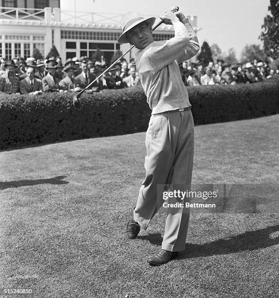 Driving from the first tee in the morning round of the $5,000 Goodall round-robin golf tournament, May 17, is Ben Hogan, who slashed two strokes from...