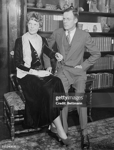 Mr. And Mrs.George Palmer Putnam, photographed in their apartment at the Hotel Wyndham, 42 West 58th Street, New York City. This is the first photo...