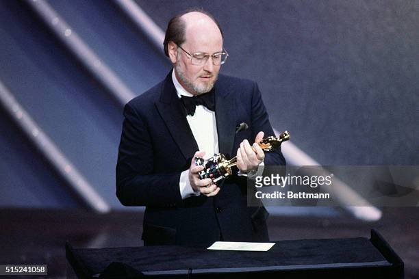 Composer John Williams gives his acceptance speech while looking at his Oscar for the Best Original Score for E.T. During the 1982 Academy Awards...