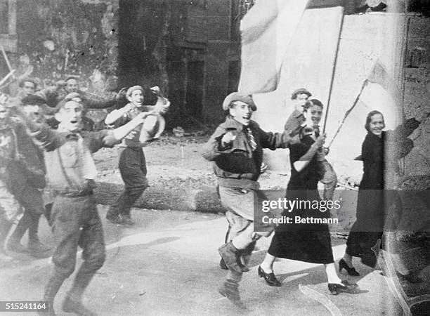 Fairly breathing the spirit of victory, this picture showing Nationalist rebel troops entering Gijon after their victorious march through the...