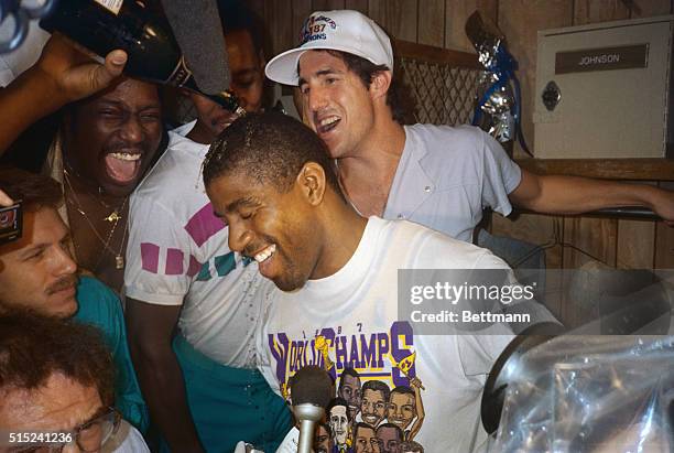 Laker guard, Magic Johnson, gets doused with champagne at press conference after the Lakers defeated the Celtics to win the NBA Championship. Johnson...