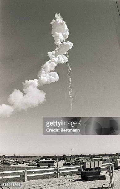 Cape Canaveral, FL- The contrail of the Space Shuttle Challenger can be seen over the Kennedy Space Center after an apparent explosion of the orbiter.