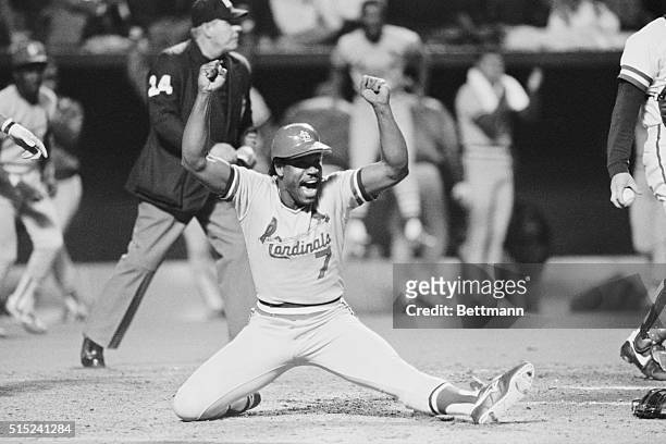 October 20, 1985 - Kansas City: Cards' Cesar Cedeno is one happy bird as he scores the team's 4th run in the 9th inning of game 2 to down the Royals...