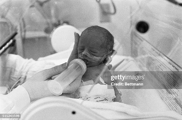 Santa Monica, CA- Peter Anas, one of the set of the world's first test-tube triplet boys born 11/5 in the Santa Monica Hospital Medical Center, cries...